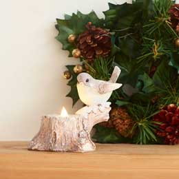 Bird on snowy stump light-up ornament product photo